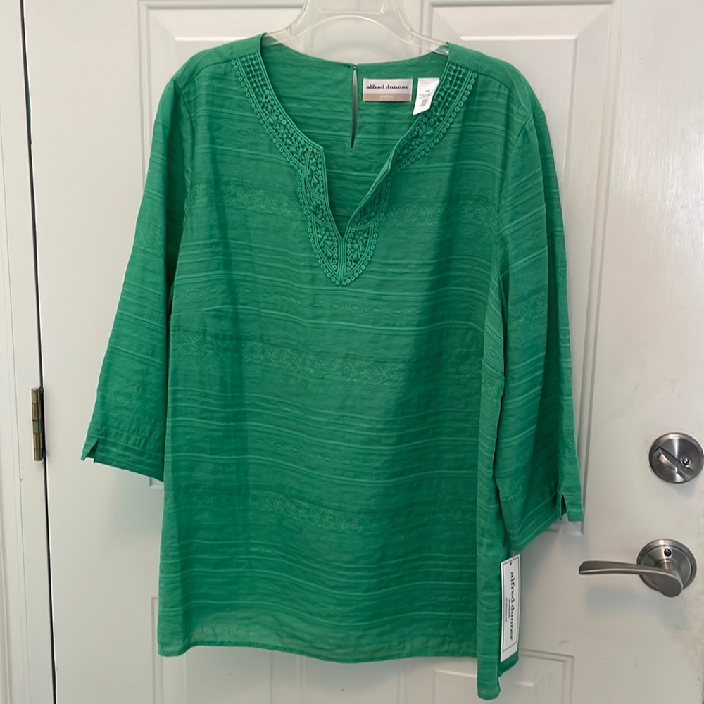 Rich green tunic with beaded neckline.
